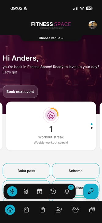 Home screen — main device Wondr member app home screen on the main device, showing a blue facility access (key) icon in the quick actions bar next to the workout, achievements, booking, history, and notifications icons.